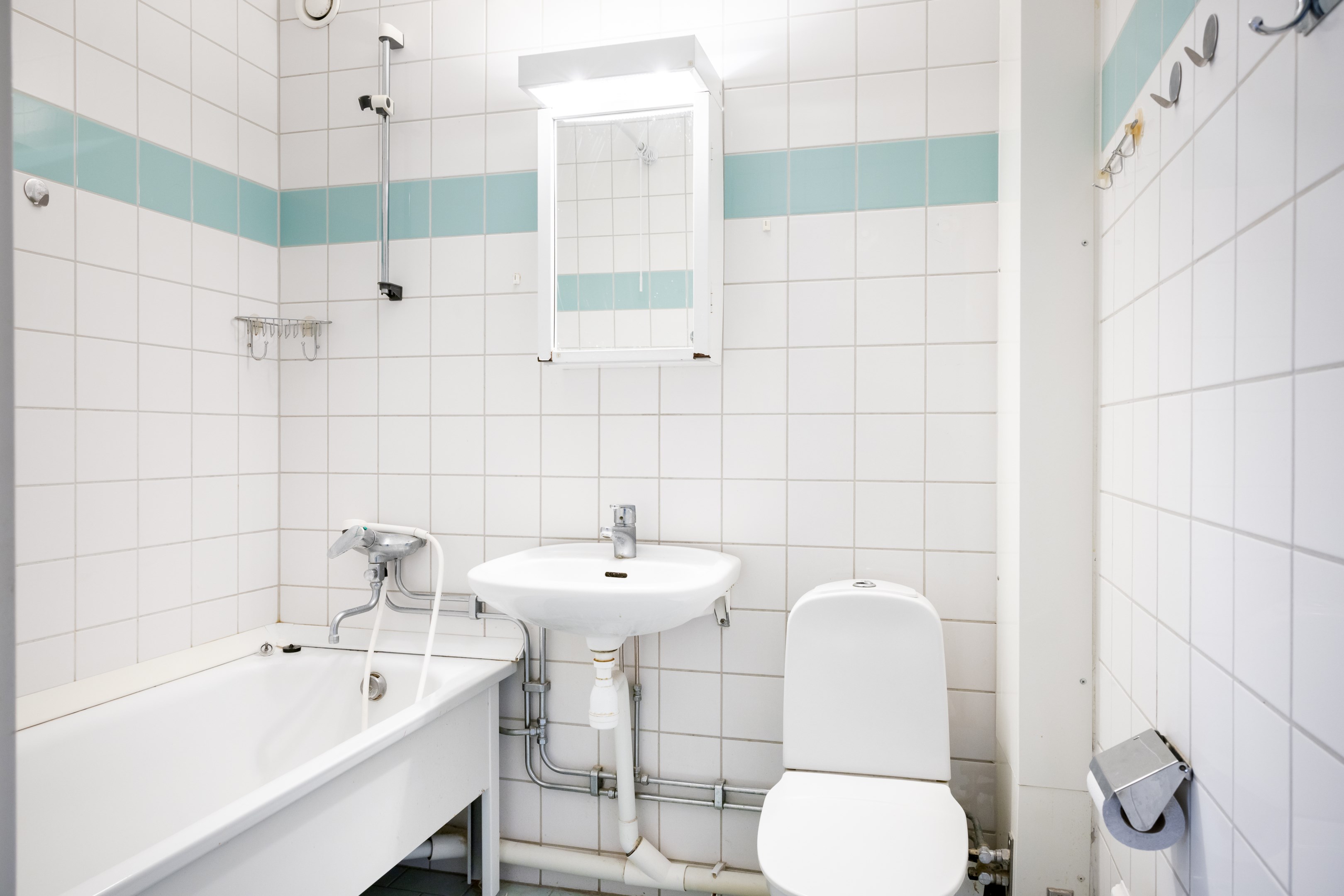 Badrum med plats för tvättmaskin