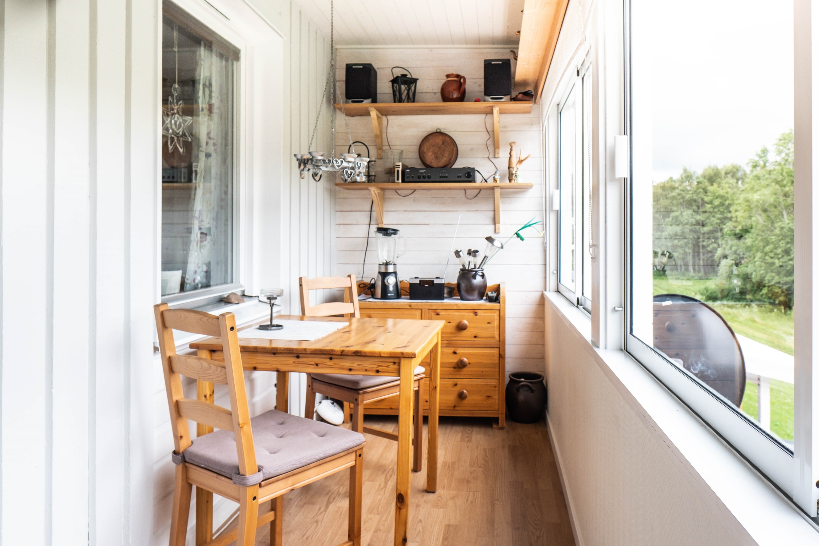 Inglasad balkong med uteplats