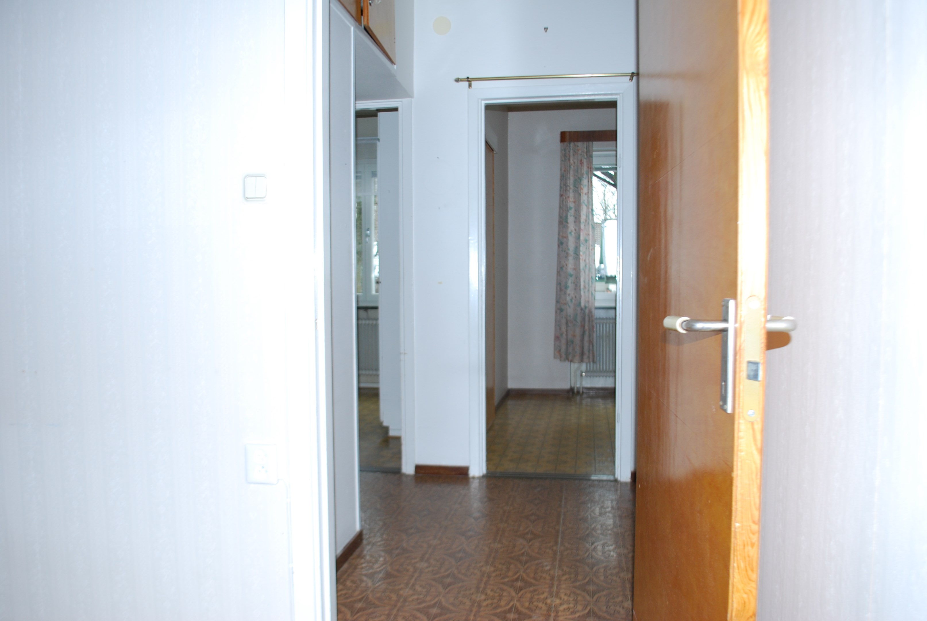 Vardagsrum mot kök och rum